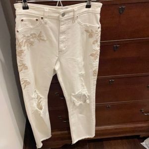 Embroidered ripped white jeans